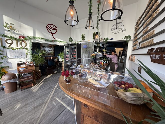 Wide view of the wooden serving counter and cake display