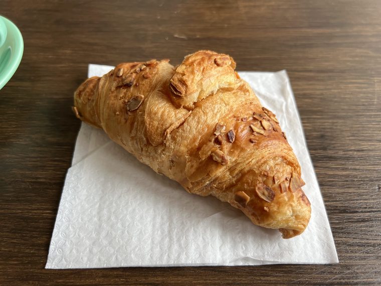 Almond croissant on a paper napkin