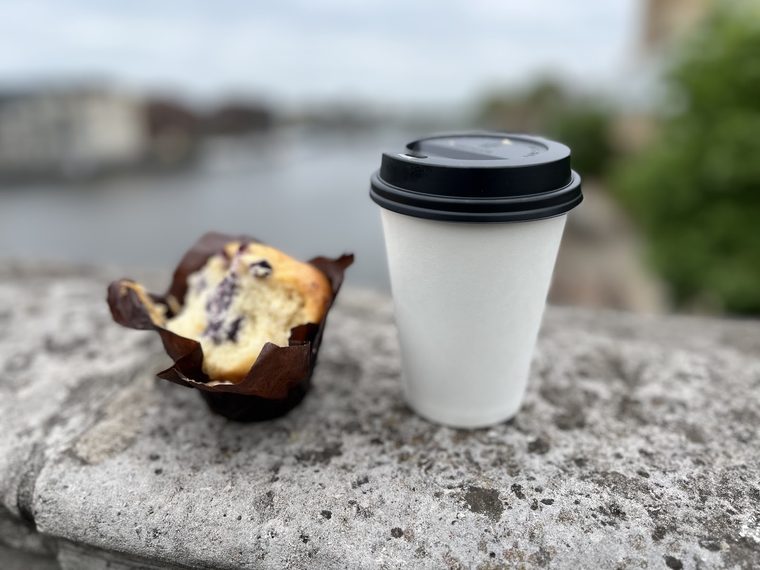 Cappuccino in a yellow cup with a chocolate-dusted heart